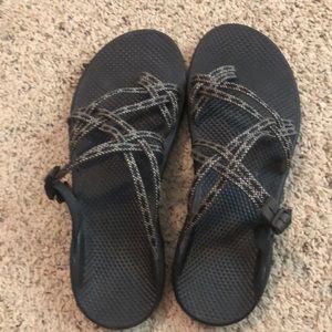 Black and white Chaco slides.